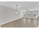 Spacious living room with beautiful wood floors, ceiling fan, and lots of natural light at 507 Gateway Townes Blvd, Wake Forest, NC 27587