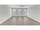Inviting living room with wood-look flooring, a ceiling fan, and plenty of natural light at 507 Gateway Townes Blvd, Wake Forest, NC 27587