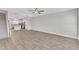 Open living space with wood floors seamlessly connects to the modern kitchen and staircase at 507 Gateway Townes Blvd, Wake Forest, NC 27587