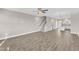 Bright and airy living space with wood floors, open staircase, and connecting to modern kitchen at 507 Gateway Townes Blvd, Wake Forest, NC 27587