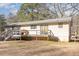 View of backyard with wooden deck at 5848 Yates Mill Pond Rd, Raleigh, NC 27606