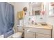 Bathroom with shower/tub combo, single sink vanity, and towel racks at 5848 Yates Mill Pond Rd, Raleigh, NC 27606