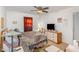 Bedroom with ceiling fan and window with red curtains providing natural light at 5848 Yates Mill Pond Rd, Raleigh, NC 27606