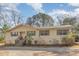 Charming single-story home featuring wood siding, green shutters, and a front porch with wooden steps at 5848 Yates Mill Pond Rd, Raleigh, NC 27606