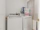 Laundry room with white washer and dryer at 5848 Yates Mill Pond Rd, Raleigh, NC 27606