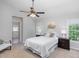 Spacious bedroom with comfortable furniture, bedside tables, and natural light from a window at 5915 Eaglesfield Dr, Raleigh, NC 27613