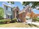 Lovely two-story home featuring a brick facade and a well-maintained front yard with lush greenery at 5915 Eaglesfield Dr, Raleigh, NC 27613