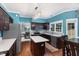 Well-equipped kitchen with stainless steel appliances, dark cabinetry, and a central island at 5915 Eaglesfield Dr, Raleigh, NC 27613