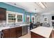 Bright and airy kitchen features stainless steel appliances and views of the backyard at 5915 Eaglesfield Dr, Raleigh, NC 27613