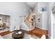 Bright living room with vaulted ceiling, hardwood floors, a staircase and natural light at 5915 Eaglesfield Dr, Raleigh, NC 27613