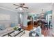 Open-concept living room flowing into a kitchen with dark cabinetry and stainless steel appliances at 5915 Eaglesfield Dr, Raleigh, NC 27613