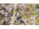 Aerial view of home, showcasing surrounding trees, and neighborhood at 6404 Dixon Dr, Raleigh, NC 27609