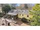 Aerial view of home's backyard, screened-in porch, and wooden walkway at 6404 Dixon Dr, Raleigh, NC 27609