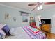 Comfortable bedroom features natural light, hardwood floors, and an exercise bike at 6404 Dixon Dr, Raleigh, NC 27609