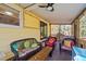 Comfortable covered patio with ceiling fan and seating area, perfect for enjoying the outdoors at 6404 Dixon Dr, Raleigh, NC 27609