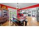 Inviting dining area featuring a large table, bench seating, and backyard access at 6404 Dixon Dr, Raleigh, NC 27609