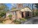 Brick home featuring a chimney, clean roofline, and side entrance at 6404 Dixon Dr, Raleigh, NC 27609