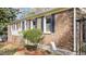 Classic brick home with manicured landscaping and inviting entryway at 6404 Dixon Dr, Raleigh, NC 27609