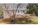Charming brick home featuring green shutters and a welcoming front porch at 6404 Dixon Dr, Raleigh, NC 27609