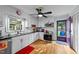 Clean kitchen showcasing white cabinets, subway tile backsplash, stainless steel appliances, and modern lighting at 6404 Dixon Dr, Raleigh, NC 27609