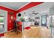 Modern white kitchen with stainless steel appliances and a breakfast bar at 6404 Dixon Dr, Raleigh, NC 27609