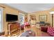 Open living space with hardwood flooring, a large window, and stylish furniture at 6404 Dixon Dr, Raleigh, NC 27609