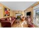 Cozy living room features hardwood floors, a fireplace, and lots of natural light at 6404 Dixon Dr, Raleigh, NC 27609