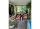 Relaxing covered porch featuring comfortable seating and decor, creating a cozy outdoor living area at 6404 Dixon Dr, Raleigh, NC 27609