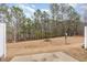 Expansive backyard with a patio, grassy area, trees, and a satellite dish at 705 Keystone Park Dr # 51, Morrisville, NC 27560