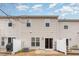 Exterior view of the rear of the house with a patio area and outdoor seating at 705 Keystone Park Dr # 51, Morrisville, NC 27560