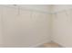 Walk-in closet features wire shelving and neutral carpeting at 705 Keystone Park Dr # 51, Morrisville, NC 27560