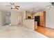 Open concept kitchen with black appliances and adjacent dining area with hardwood floors at 705 Keystone Park Dr # 51, Morrisville, NC 27560