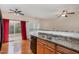 Bright kitchen features a stainless steel double sink, neutral countertops, and sliding glass door leading to outdoor space at 705 Keystone Park Dr # 51, Morrisville, NC 27560