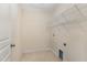 Functional laundry room featuring tile floors and wire shelving for optimal organization at 705 Keystone Park Dr # 51, Morrisville, NC 27560