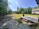 Spacious backyard featuring a wood deck and room to add outdoor amenities at 7103 Big Horn Dr, Hillsborough, NC 27278
