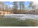 Large backyard with a wood fence, offering privacy and ample outdoor space at 7103 Big Horn Dr, Hillsborough, NC 27278