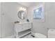 Bathroom with a vanity and a modern toilet, filled with ample natural light at 7103 Big Horn Dr, Hillsborough, NC 27278