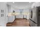 Modern kitchen featuring white cabinets and stainless steel appliances at 7103 Big Horn Dr, Hillsborough, NC 27278
