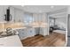 Spacious kitchen featuring stainless appliances and a view into the dining area at 7103 Big Horn Dr, Hillsborough, NC 27278