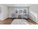 View of living room with a window view and stylish furniture, filled with natural light at 7103 Big Horn Dr, Hillsborough, NC 27278