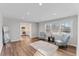 Spacious living room with hardwood floors, natural light, and stylish decor at 7103 Big Horn Dr, Hillsborough, NC 27278