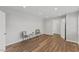 Living room with stylish chairs, side table, and wood-look flooring at 7103 Big Horn Dr, Hillsborough, NC 27278