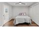 View of main bedroom with ensuite bathroom, featuring a large closet and durable hardwood flooring at 7103 Big Horn Dr, Hillsborough, NC 27278