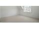 Bright bedroom featuring a window providing ample natural light at 7112 Camp Side Ct, Raleigh, NC 27613