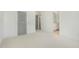 Bedroom with neutral walls and carpeted flooring with views to bath at 7112 Camp Side Ct, Raleigh, NC 27613