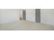 Bedroom with neutral walls and carpeted flooring, featuring two doors at 7112 Camp Side Ct, Raleigh, NC 27613