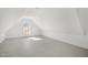 Bright, spacious bonus room with a window, freshly painted in white, perfect for various activities at 7112 Camp Side Ct, Raleigh, NC 27613