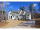 Charming two-story home with white and sage green siding, and a beautifully landscaped yard at 7112 Camp Side Ct, Raleigh, NC 27613