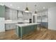 Spacious kitchen with stainless steel appliances, a large island, and ample storage at 7112 Camp Side Ct, Raleigh, NC 27613