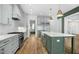 Well-equipped kitchen with stainless appliances and a large island with seating at 7112 Camp Side Ct, Raleigh, NC 27613